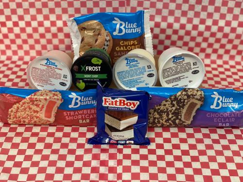 A variety of ice cream products, including Blue Bunny bars and Fat Boy, displayed on a red and white checkered background.
