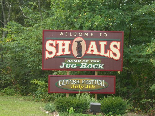 Welcome sign for Shoals, Indiana, featuring "Home of the Jug Rock" and details about the Catfish Festival on July 4th.
