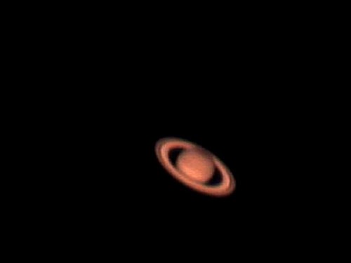 A close-up view of Saturn, showcasing its iconic rings against a black background.