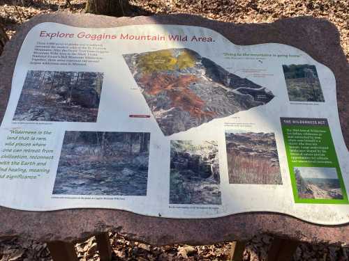 Informational sign about Goggins Mountain Wild Area, featuring maps and text on wilderness conservation and local ecology.