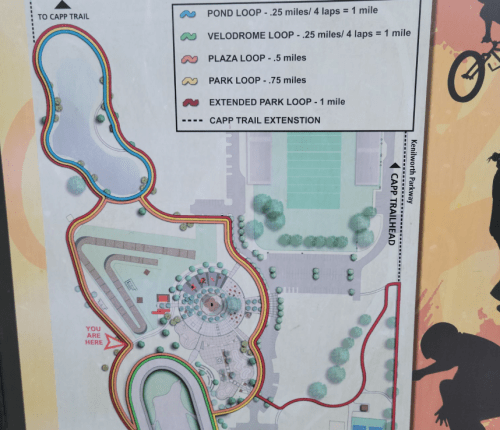 Map of a park trail with various loops and distances, indicating locations and paths for walking or biking.