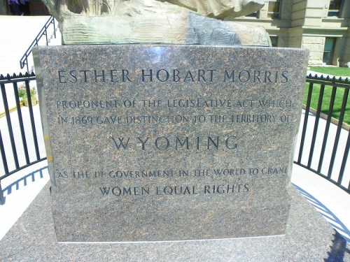 Granite monument honoring Esther Hobart Morris, advocate for women's rights in Wyoming, inscribed with her achievements.