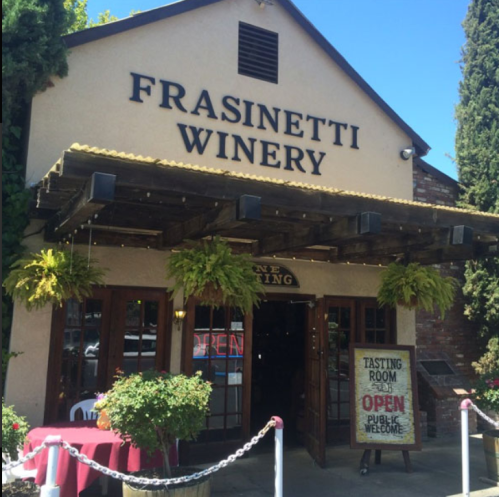 Exterior of Frasinetti Winery with a welcoming entrance, open sign, and a tasting room announcement.
