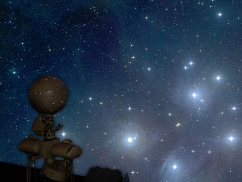 A robotic figure gazes at a starry night sky filled with bright stars and cosmic colors.