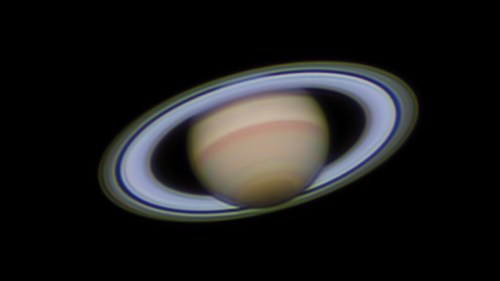 A vibrant image of Saturn, showcasing its iconic rings against a dark background.