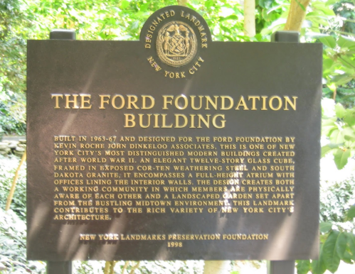 A plaque describing the Ford Foundation Building, highlighting its design and significance in New York City.