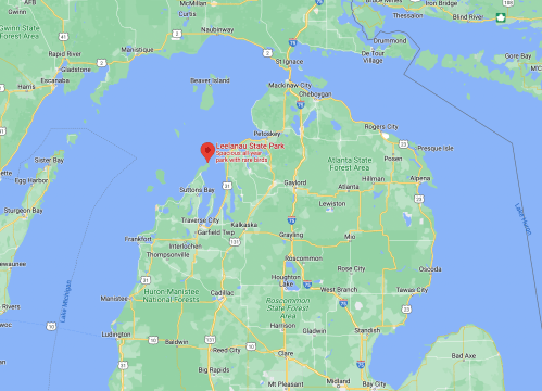 Map showing Leelanau State Park in Michigan, highlighting its location near Lake Michigan and surrounding areas.