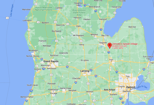Map showing Michigan with a marker for Zehnder's Splash Village near Frankenmuth, highlighting nearby cities.