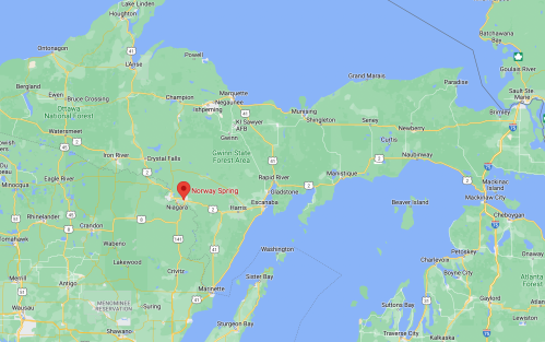 Map showing the location of Norway Spring in Michigan, surrounded by lakes and nearby towns.
