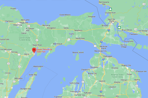 Map highlighting the Upper Peninsula State Fair location in Michigan, near Lake Michigan and Lake Huron.