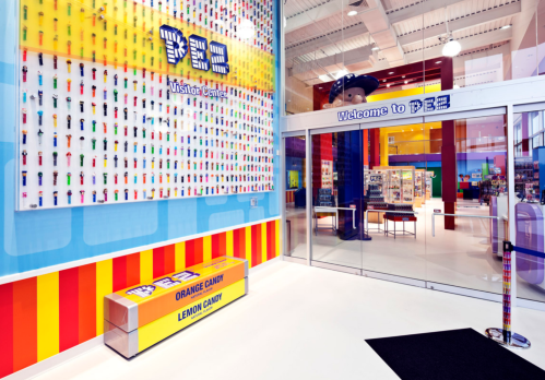 Brightly colored PEZ Visitor Center entrance with a display of PEZ dispensers and candy boxes.