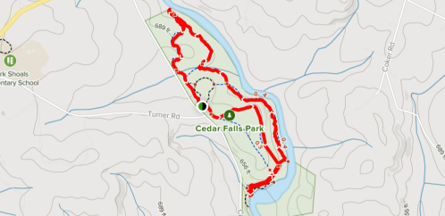 Map of Cedar Falls Park showing a marked trail in red, with surrounding roads and landmarks.