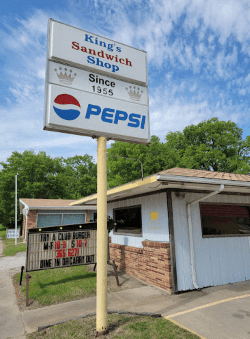 Sign for King's Sandwich Shop, featuring Pepsi logo, with a message about a club burger special and dining options.