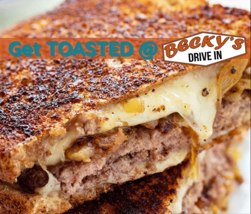 Close-up of a toasted sandwich with melted cheese and meat, featuring a sign that reads "Get TOASTED @ Becky's Drive In."