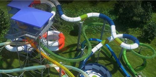 A colorful water slide complex with multiple twisting slides and a tall observation tower in a green park setting.