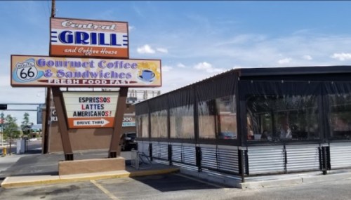 Sign for Central Grille and Coffee House featuring "Gourmet Coffee & Sandwiches" with a drive-thru area.