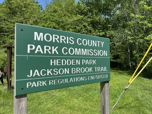 Sign for Morris County Park Commission, indicating Hedden Park and Jackson Brook Trail with park regulations enforced.