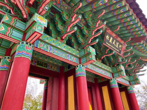 Colorful traditional architecture featuring intricate patterns and vibrant columns, showcasing cultural design elements.