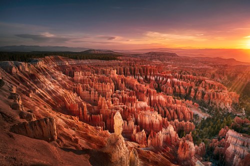 A stunning sunset over Bryce Canyon, highlighting its unique rock formations and vibrant colors.