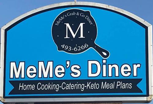 Sign for MeMe's Diner featuring a logo, contact number, and text about home cooking, catering, and keto meal plans.