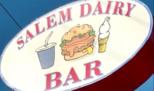 Sign for "Salem Dairy Bar" featuring a burger, ice cream cone, and drink illustration.