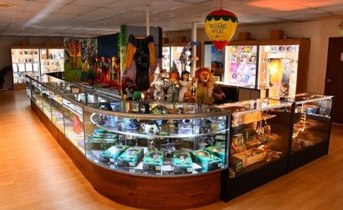 A display area featuring various collectibles and memorabilia, including items from "The Wizard of Oz."
