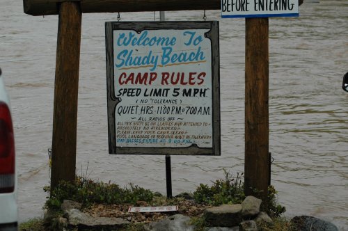 Sign at Shady Beach listing camp rules, including a 5 mph speed limit and quiet hours from 11 PM to 7 AM.