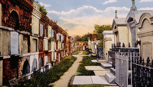 A serene cemetery pathway lined with ornate tombs and mausoleums under a blue sky with fluffy clouds.