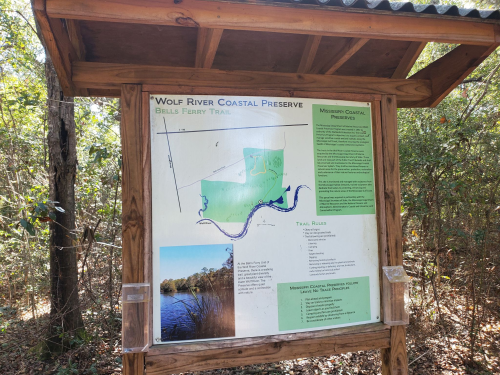 Sign for Wolf River Coastal Preserve, detailing the Bills Ferry Trail and surrounding natural features.