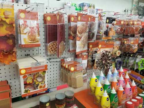 A display of baking supplies, including cookie cutters, molds, and decorating tools, in a craft store.