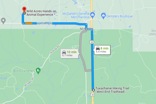 Map showing directions from Wild Acres Hands on Animal Experience to Tuxachanie Hiking Trail, with estimated travel times.