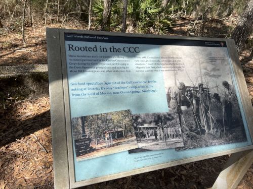 Sign about the Civilian Conservation Corps (CCC) at Gulf Islands National Seashore, detailing its history and impact.