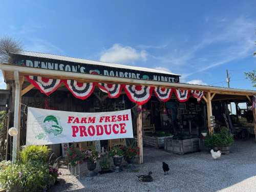 A rustic market with a "Farm Fresh Produce" sign, decorated with red, white, and blue bunting, surrounded by greenery.