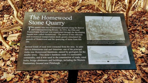 Sign about the Homewood Stone Quarry, detailing its history and significance in the region's development.