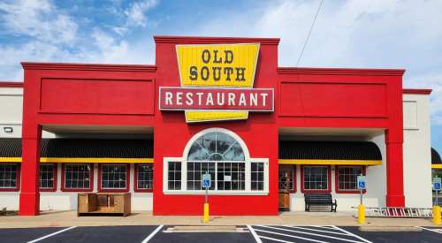 Bright red restaurant exterior with "Old South Restaurant" sign, large windows, and accessible parking.