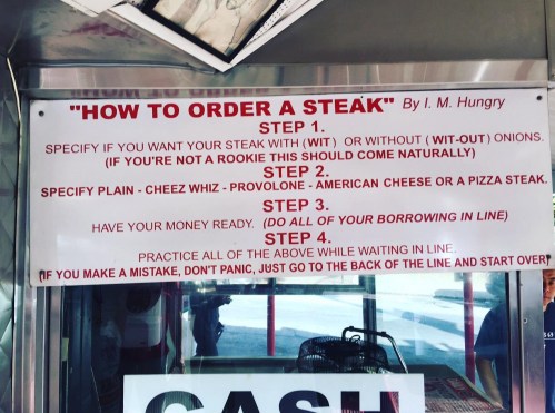 Sign with instructions on how to order a steak, including steps for specifying preferences and payment.
