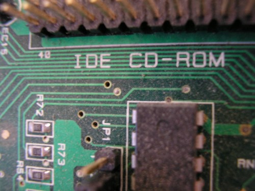Close-up of a circuit board featuring the label "IDE CD-ROM" and various electronic components and connections.