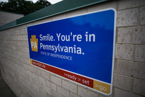 Sign welcoming visitors to Pennsylvania, stating "Smile. You're in Pennsylvania. State of Independence."
