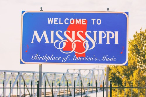 Welcome sign for Mississippi, featuring musical notes and the phrase "Birthplace of America's Music."