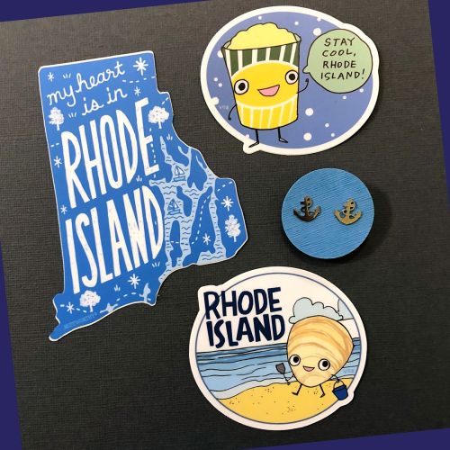 A collection of Rhode Island-themed stickers, including a map, a cute character, and a button with anchors.