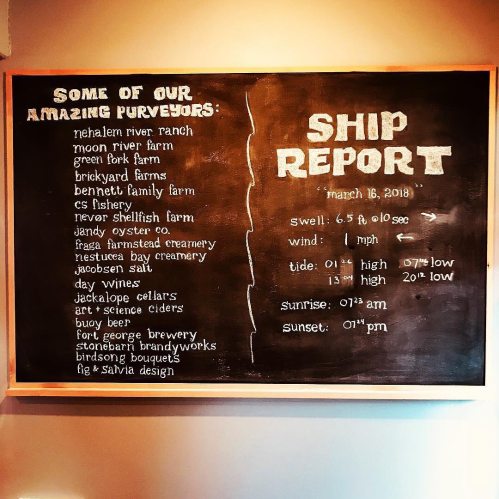 Chalkboard menu listing purveyors and ship report details for March 16, 2018, including swell, tide, and sunset times.