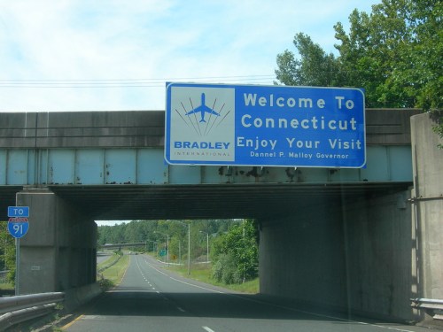 Sign welcoming travelers to Connecticut, featuring Bradley International Airport and a message from Governor Dannel P. Malloy.