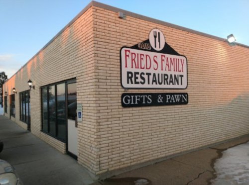 Exterior of Fried's Family Restaurant, featuring a sign that also indicates gifts and pawn services.