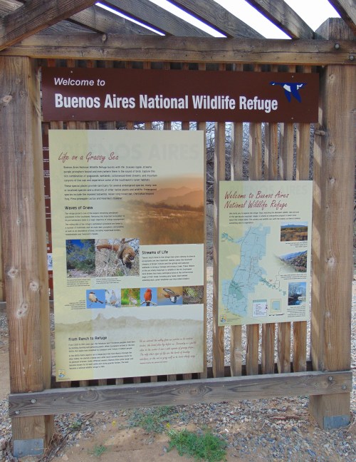 Sign at Buenos Aires National Wildlife Refuge, featuring information about local wildlife and a map of the area.