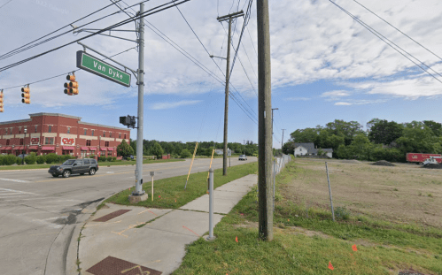 Intersection of Van Dyke with a CVS nearby; empty lot and power lines visible under a clear sky.