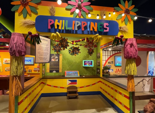 Colorful exhibit representing the Philippines, featuring vibrant decorations and cultural displays.