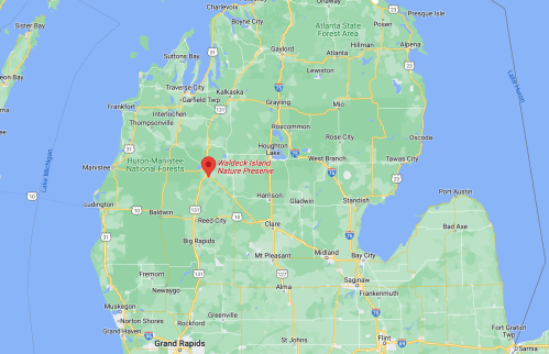 Map showing Wakeley Island Nature Preserve in Michigan, surrounded by lakes and forests.
