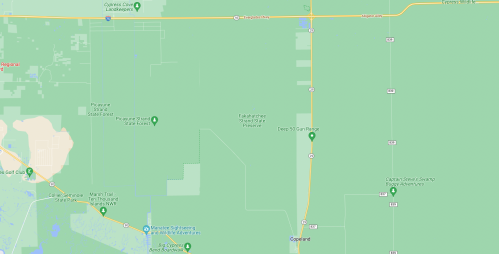 Map showing a green landscape with roads and a few labeled locations, primarily in a rural area.