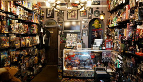 A vibrant collectibles shop filled with action figures, memorabilia, and posters, showcasing a variety of pop culture items.