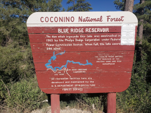 Sign for Blue Ridge Reservoir in Coconino National Forest, detailing the lake's history and management information.